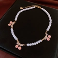 Floral pearl choker with pink cherry charms and sparkling crystal leaf details - White Pearl/Cherry Saturn