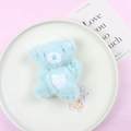Cute light blue plush teddy bear with white heart embroidery on a decorative plate - Single Bear / Green Bear