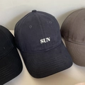 Close-up of cotton baseball caps in black, navy, and brown with SUN embroidery - M (56-58cm) / Navy Blue