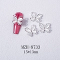 Detail showing 3D opal butterfly nail charm with silver alloy frame and center rhinestone - White Cat Eye Butterfly Silver Base (8733)