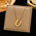 Minimalist gold-plated letter U pendant necklace in 3D metallic style on jewelry box - Gold-U