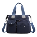 Blauwe nylon schoudertas, grote praktische handtas en multifunctionele reistas voor dames. - Donkerblauw
