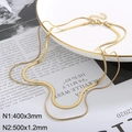 Double-layered 18k gold plated flat snake chain necklace on minimalist display - Gold Double Layer Snake Bone Chain (KN232351-Z)