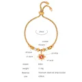 Elegant gold titanium steel bracelet featuring a sun evil eye charm and crystal details - E454-Red Enamel Gold Color Bracelet