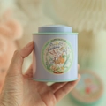 Mini lavender bunny tin box for tea or candy held in hand with mint green trim details - Lily of the Valley Rabbit