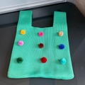 Neon green knitted tote bag featuring colorful plush pom-pom decorations and chunky texture - Rainbow Ball Green