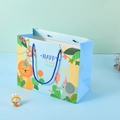 Light blue cartoon animal gift bag featuring lion and elephant with navy woven handles - Small / 18x16x10cm / Blue