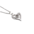 Silver heart pendant necklace with micro-pave cubic zirconia and projection stone - White Gold