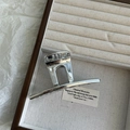 Close-up of a silver hair claw clip with mirror finish on a wooden jewelry tray - Silver / Medium 10.5cm