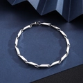 Close-up of a silver stainless steel Cuban link bracelet with lobster clasp on textured paper - Rod Link Bracelet [Width 3mm] / Length 21cm