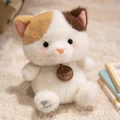 Adorable plush calico cat stuffed animal toy in sitting pose with heart embroidery - Sitting Cat