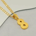 Macro view of gold stainless steel number 8 pendant necklace on textured grey fabric - Number 8 Pendant Only (Without Chain)