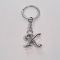 Sleek silver metal letter K keychain with round ring and chain on white background - Letter K / Silver