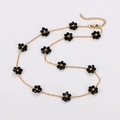 Minimalist daisy flower necklace with black floral beads on a golden chain - Black