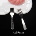 Macro shot of 4x19mm miniature silver metal forks for dollhouse and play food kits - Small Alloy Fork (4x19mm)