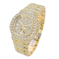 Detail of gold luxury watch featuring full diamond setting and date display window - Gold