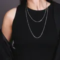 Double-layered silver snake chain necklace set for women worn by a fashion model - 1.2 Meters Silver