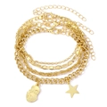 Gold multi-layered bracelet set with butterfly, star, and face charms in a metallic finish - Style 8-Gold Face Profile Star Set