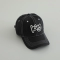 Detailed view of black cotton baseball cap with white contrast stitching and KING embroidery - Letter KING / Black