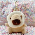 Cute capybara plush keychain wearing a toast collar on colorful pastel foam balls - Donut Light Brown + Gold Clip