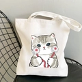 Kawaii white canvas shoulder bag featuring a cute grey striped cat holding small flowers - Tabby Cat Holding Flowers