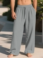 Detail of grey linen pants featuring an elastic drawstring waist and breathable fabric texture - Gray