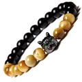 Macro view of natural tiger eye beads and dark metal wolf head charm on beaded bracelet - Gold Tiger Eye