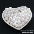 Single-hole white ABS imitation pearls displayed in a heart-shaped ceramic bowl - Premium Half Drilled / 12mm / Pure White