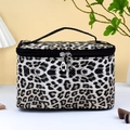 Leopard print makeup bag with black top handle and dual zippers in studio setting - Leopard Print Large Square Bag