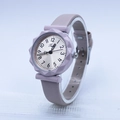 Detail of lilac silicone strap and sunflower-shaped bezel on minimalist quartz watch - Off White
