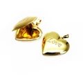 Polished gold heart locket showing open and closed states with Love engraving - LOVE Lettering