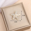 Golden starfish brooch with white zircon pavé setting measuring 3cm by 3cm - Starfish