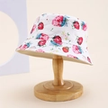 Close-up of white cotton sun hat with strawberry print on a wooden stand - Kids One Size / White (Strawberry/Flower)