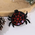 Detail of plush black spider hair clip with red embroidery for Halloween decorations - Spider Hair Clip
