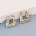 Macro shot of silver-tone irregular geometric trapezoid earrings with hammered texture - Silver Style K7-82