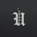 Macro detail of Gothic-style letter V pendant in polished silver stainless steel - Letter U