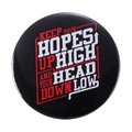 Round black badge with red and white inspirational English text and arrow design - KEEP YOUR HOPES UP HIGH