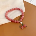 Close-up of pink strawberry quartz bracelet with a white pearl and crystal charms - Strawberry Crystal and Pearl Style (34#) / Pink