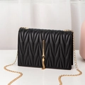 Black V-quilted faux leather crossbody bag with a gold tassel and metal chain strap - Diamond Quilt / Black Diamond Quilt