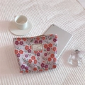 Flat lay of floral canvas makeup bag with TIME TO PARTY label on quilted fabric background - Light Purple