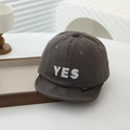Detailed close-up of charcoal grey baby baseball cap with white YES embroidery - Gray / 48cm (Infant Toddler)