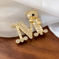 Detail of vintage gold bear brooch with sparkling rhinestones on an M-shaped base - Rhinestone Enamel Bear Letter M (8#)