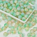 Detailed view of 10mm turquoise and orange crackle glass beads for DIY jewelry making - Cyan Orange (10mm Protein Jade)