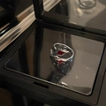 Unique silver fluid-style ring with red gemstone inlay presented on a black mirror box - Assassin Style (刺客戒指)