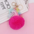 Close-up of glittery unicorn plush keychain with lace trim on a pink background - Unicorn (Gold Chain Buckle) / Rose Red