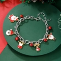 Detailed shot of Christmas bracelet with Santa, reindeer charms and small red bells - D1244 (Silver Chain Red White Santa)