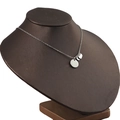 Silver stainless steel necklace with double round disc pendants on a brown display stand - Steel Color (Large Disc + 3 Small Discs)