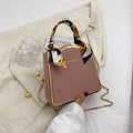 Pink minimalist box bag with golden metal frame and silk ribbon handle detail - Pink