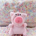 Cute pink plush pig keychain with silver bead chain on colorful foam background - Pig Hat Pink + Bead Chain