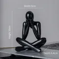 Abstract black resin figurine in seated pose, size 8x10cm, modern minimalist sculpture - Style D Black